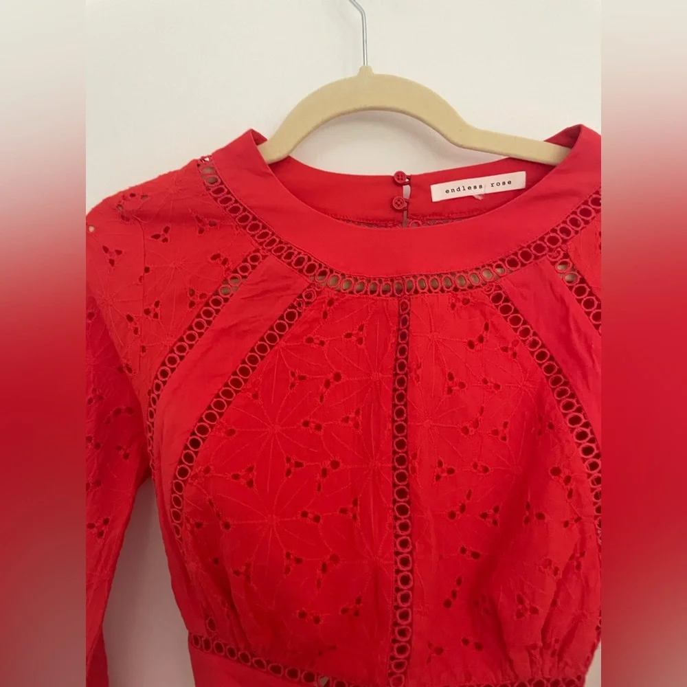 Endless Rose eyelet crop top with open back. Size small